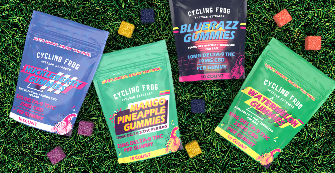 Cycling Frog gummy bags laid on the grass